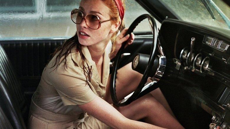 The Lady in the Car with Glasses and a Gun image
